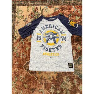 American Fighter 1974 Athletics Raglan T-Shirt Blue & White Heather Graphic Tee